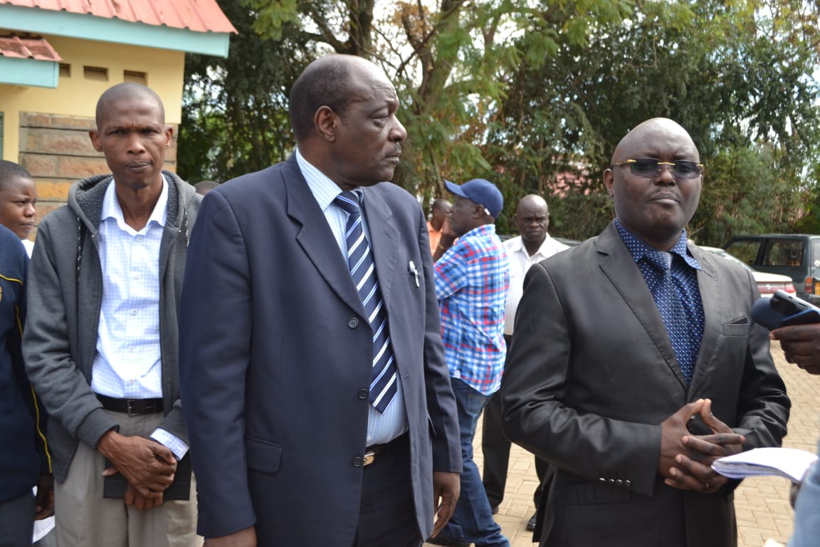 Dr Richard Muga (left),CEC Homabay County looks on as the health officials offload medical commodities from the KEMSA truck with him is Dr Kenneth Bukachi (right) Regional Sales Executive,KEMSA.